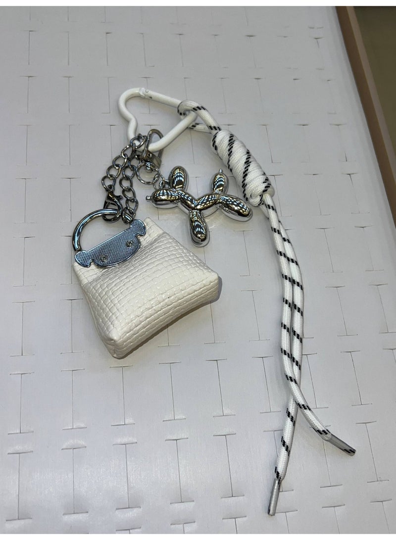 A stylish heart-shaped bag and keychains in assorted colors - Image 2